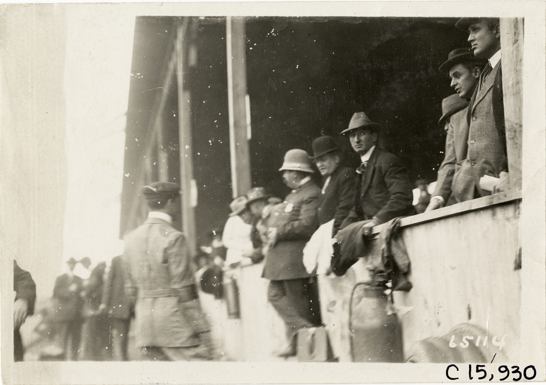 Policeman in front of grandstand, 1910 Vanderbilt Cup races