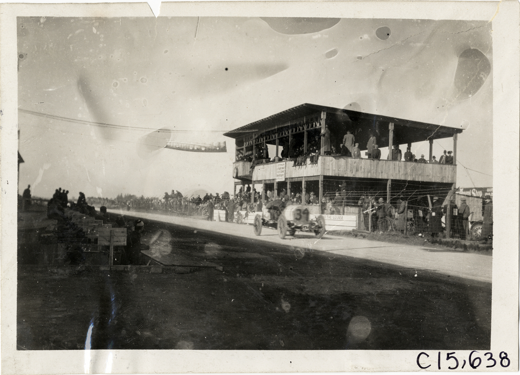 Driver and passenger in racecar, 1909 Vanderbilt Cup races