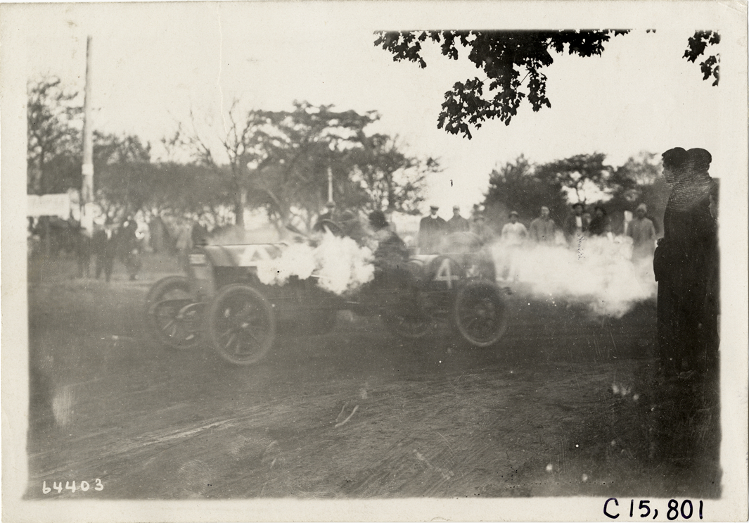 Driver and passenger in racecar, 1910 Vanderbilt Cup races