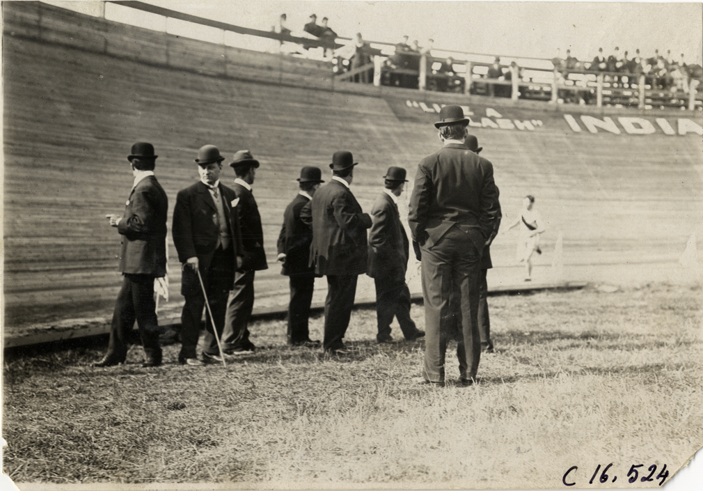 Officials watching runner