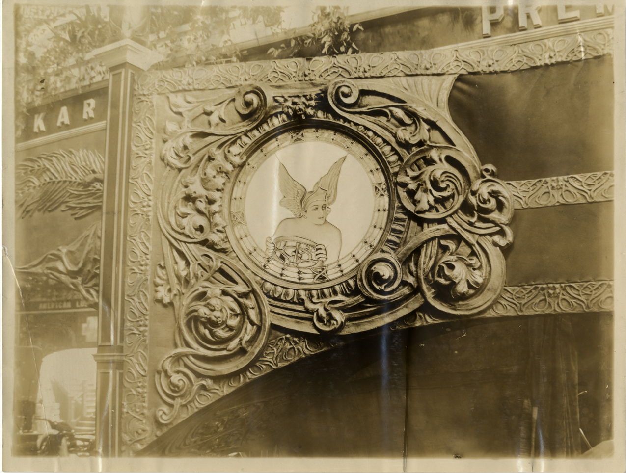 Decoration of Mercury driving an automobile, 1909 Chicago Auto Show