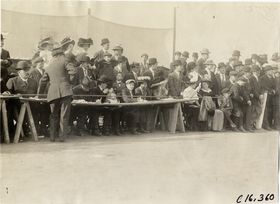 Officials and spectators at track meet
