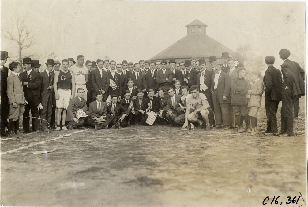 Runners and officials at track meet