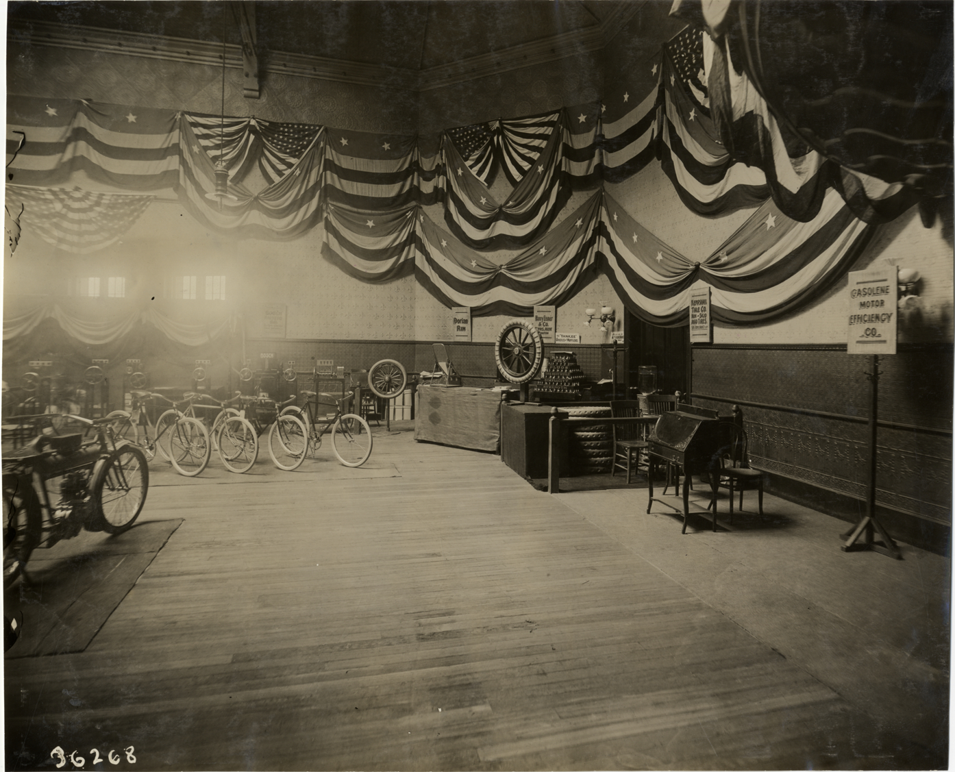 Motorcycle and bicycles on exhibit, 1910 Boston Auto Show