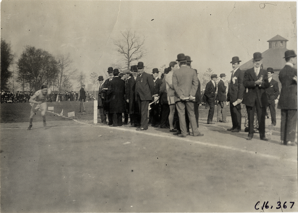 Officials watching runner