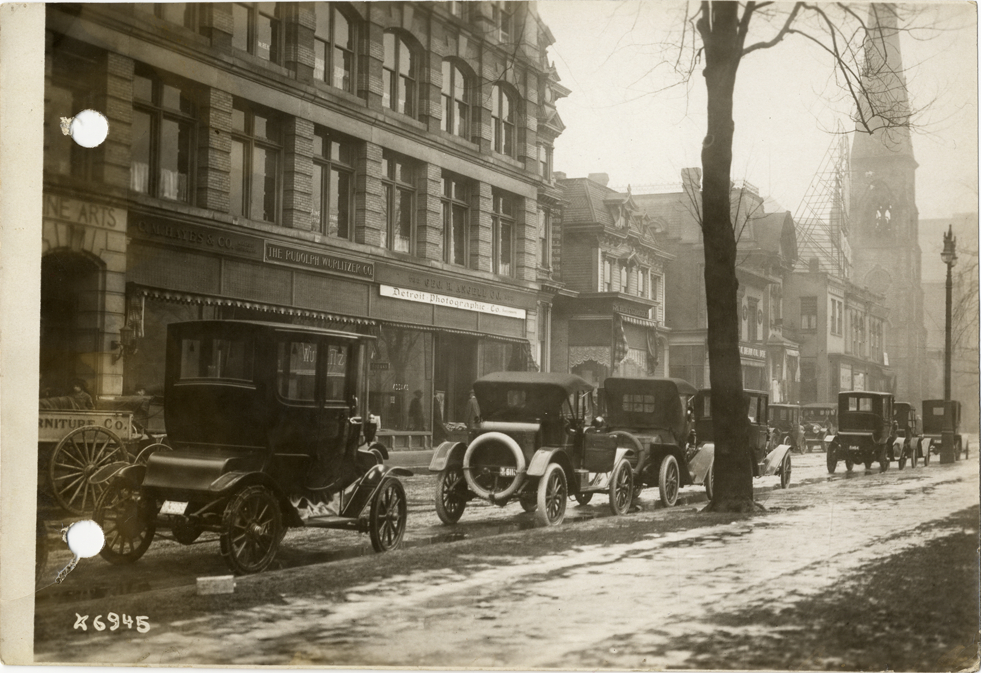 Automobiles parked on Adams Street