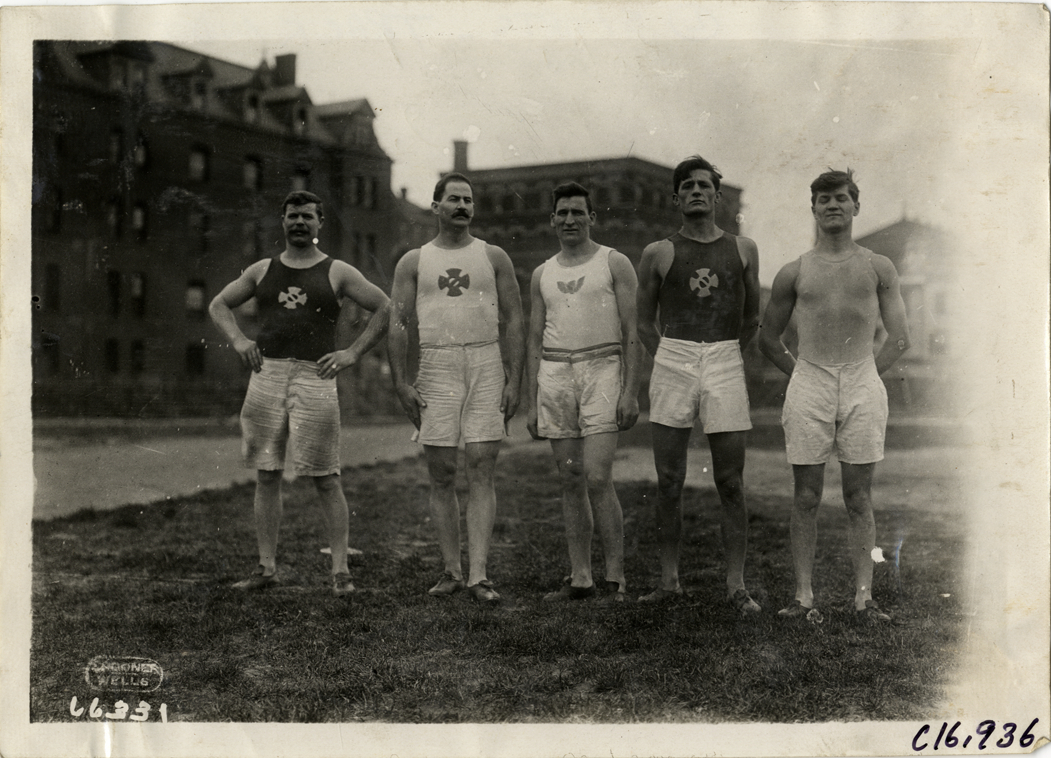 Track and field athletes posing in field