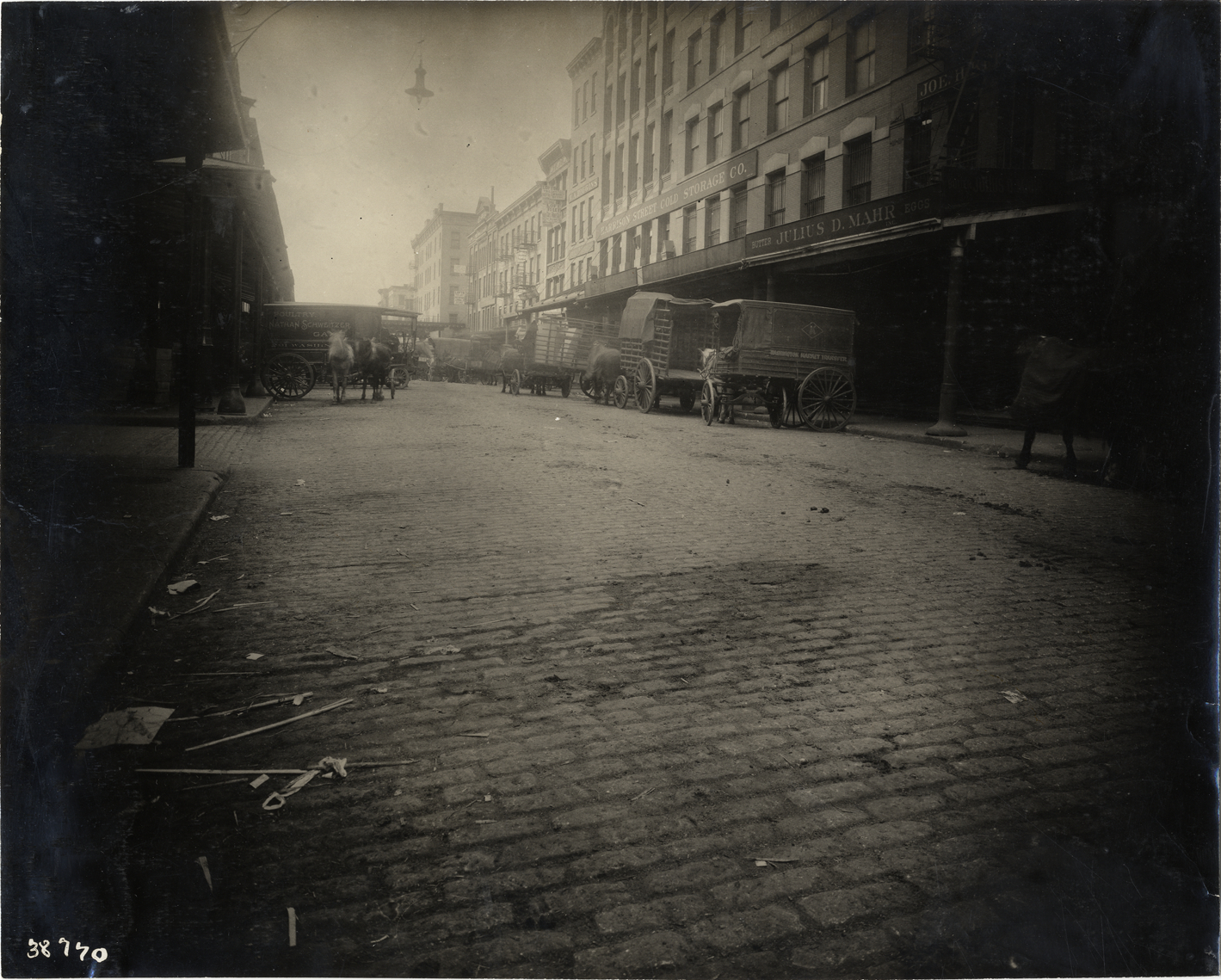 Horse-drawn wagons on Harrison Street, New York