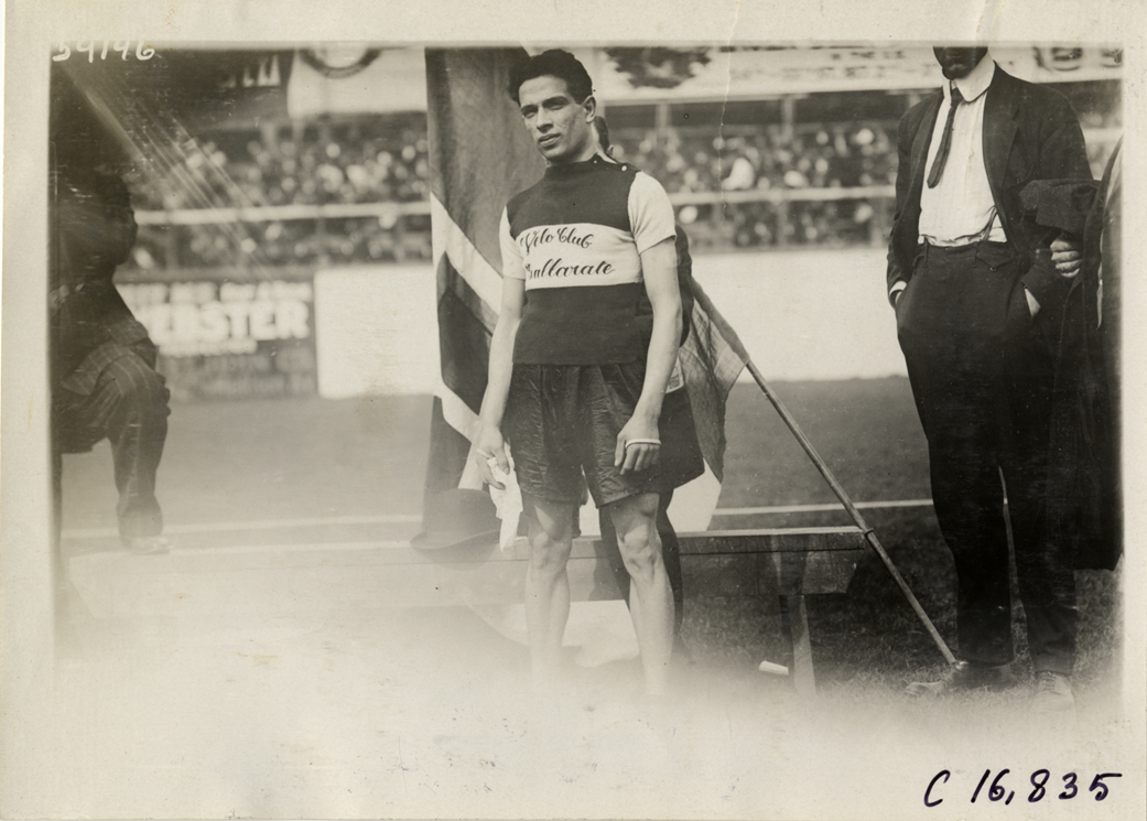 Marathon runner posing with flag