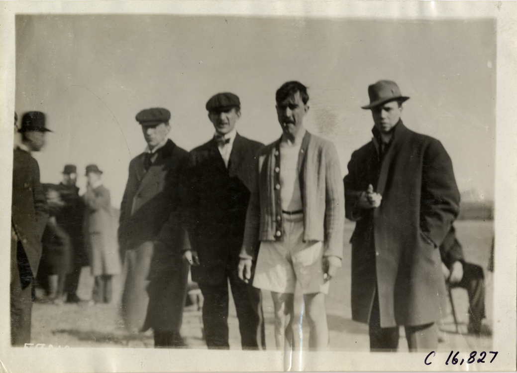 Runner posing with officials