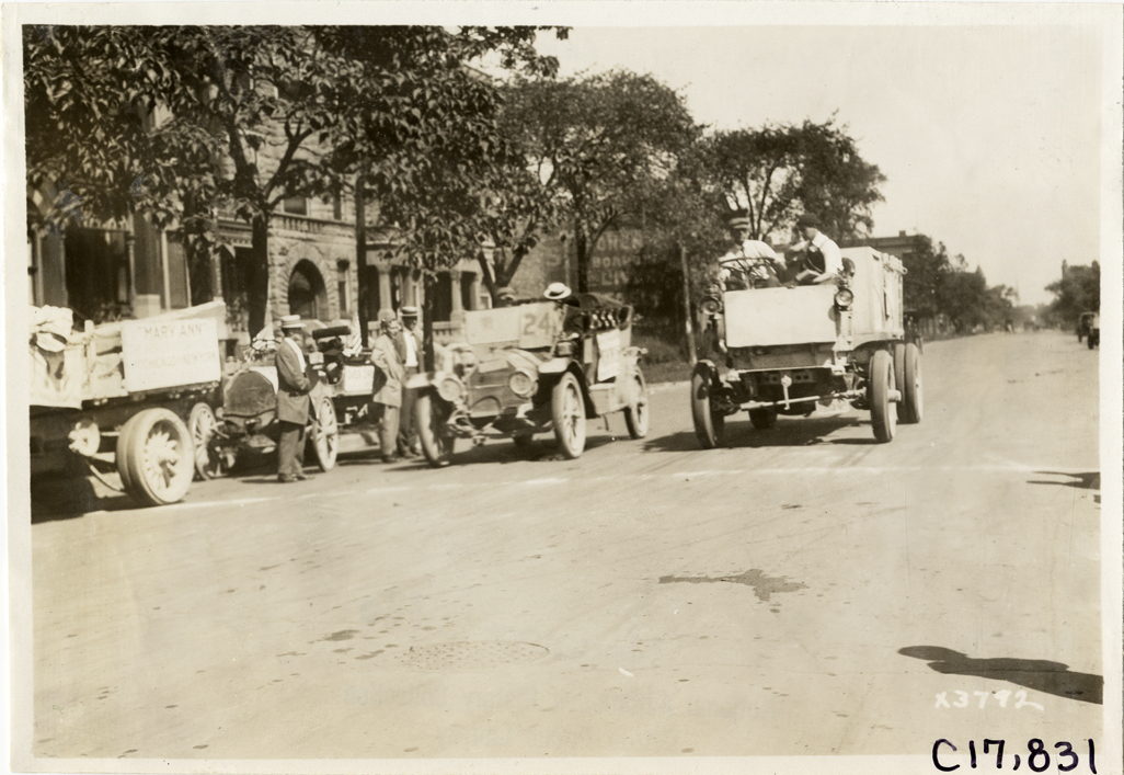 Trucks lined up in road, 1911 Chicago Reliability Run