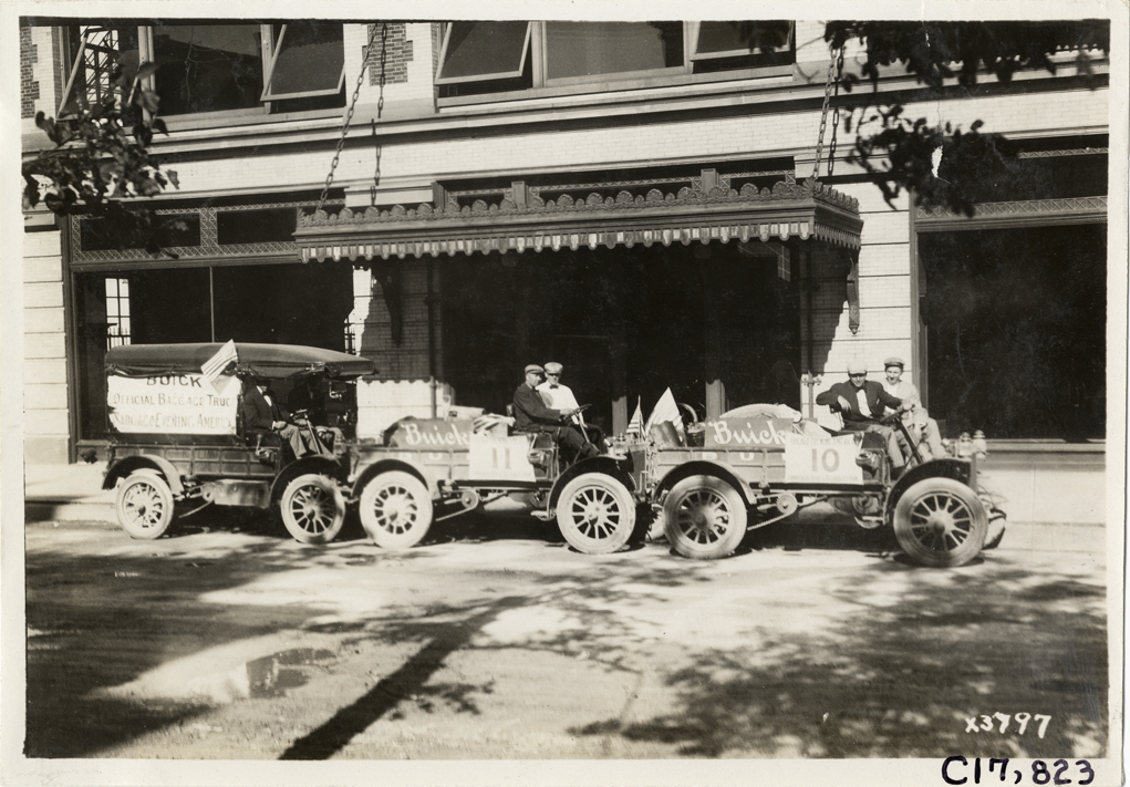 Buick trucks parked in front of commercial building, 1911 Chicago Reliability Run