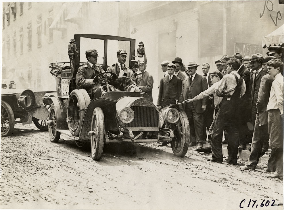 Driver and passenger in Thomas taxi in front of Morgan House hotel, 1909 Catskill-Berkshire Tour