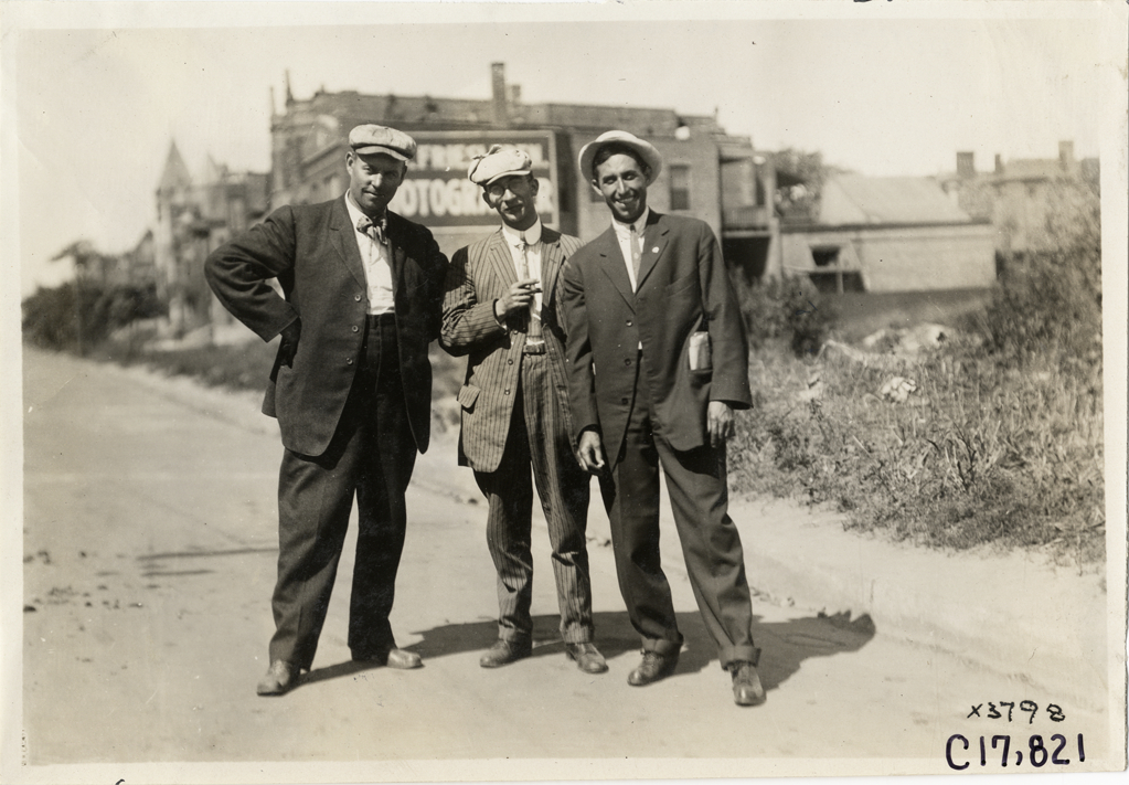 Men posing in road, 1911 Chicago Reliability Run