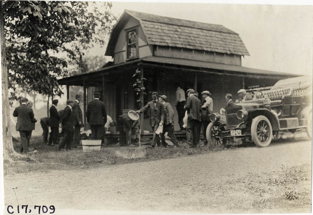 Motorists and automobile in front of house at Highland Mills, New York, 1909 Catskill-Berkshire Tour