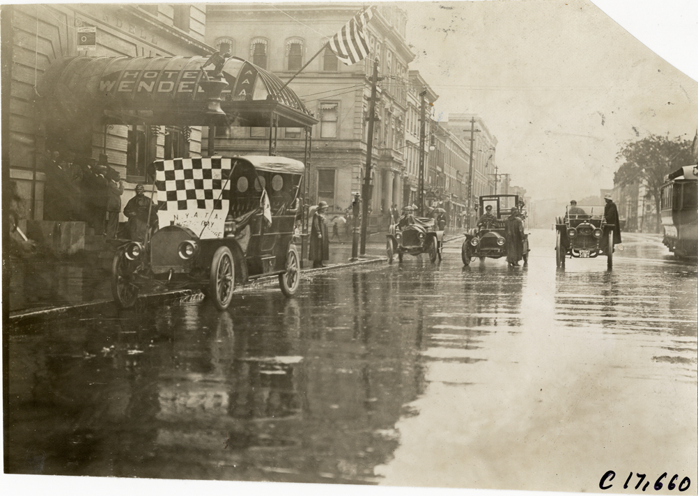 Automobiles parked in front of Hotel Wendell on rainy day, 1909 Catskill-Berkshire Tour