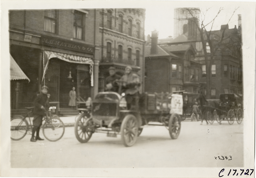 Driver and passenger in truck, 1910 Chicago Motor Truck Run