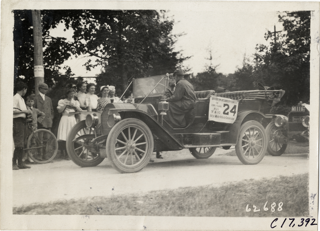 Driver and passenger in automobile, 1910 Brooklyn Dealers Reliability Run