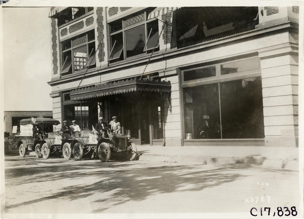 Buick trucks parked in front of commercial building, 1911 Chicago Reliability Run