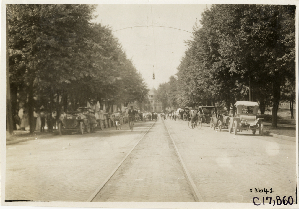 Trucks and automobiles parked on street, 1911 Chicago Reliability Run