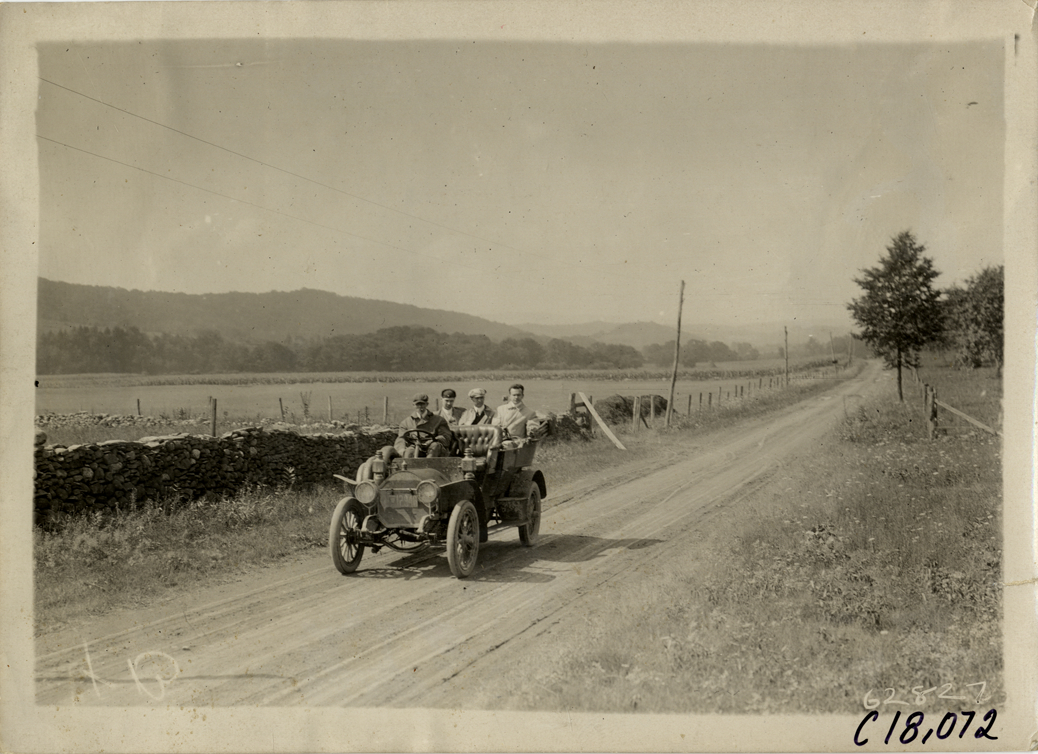 Officials in automobile, 1910 Federation of American Motorcyclists Endurance Run