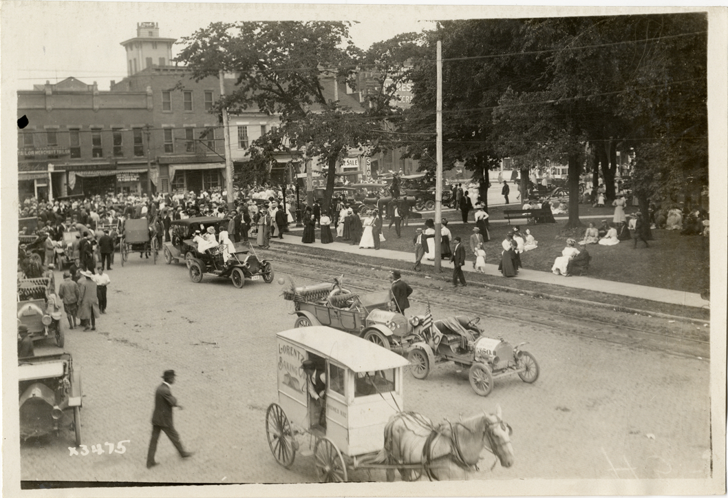 Automobiles and crowd in street, 1911 Cleveland Reliability Run