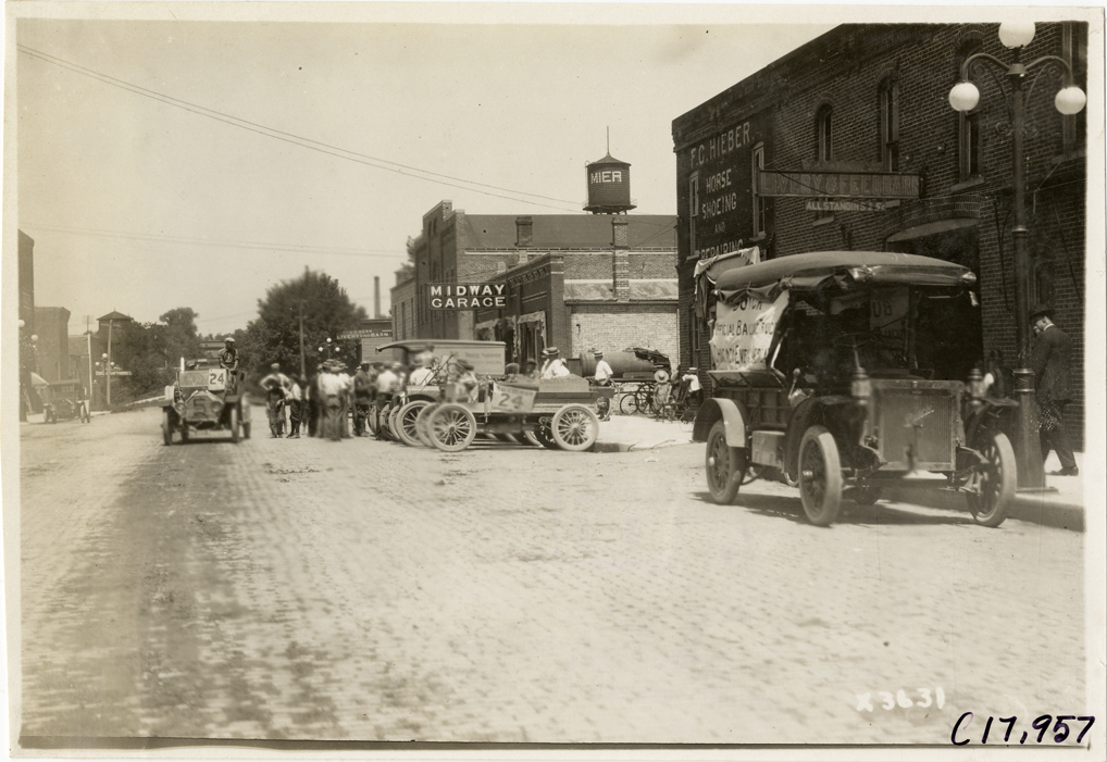 Trucks parked in street at Mier, Indiana, 1911 Chicago Reliability Run