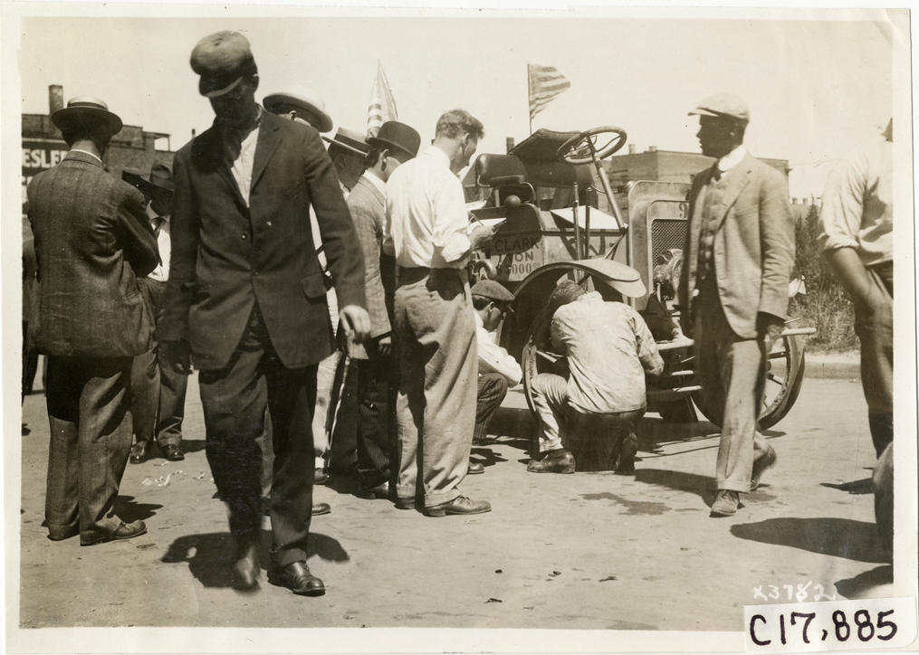 Men examining Clark truck, 1911 Chicago Reliability Run