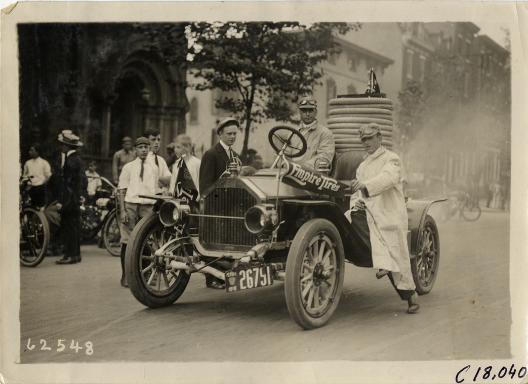Motorists with Empire Tires automobile, 1910 Federation of American Motorcyclists Endurance Run