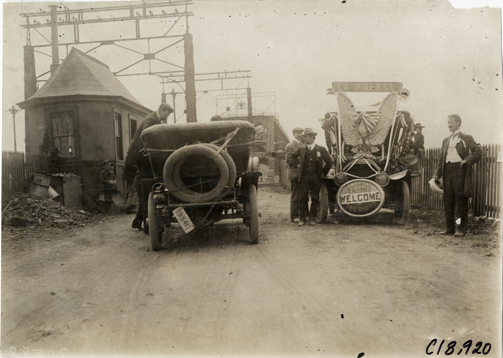 Automobiles at approach to bridge, 1906 Glidden Tour