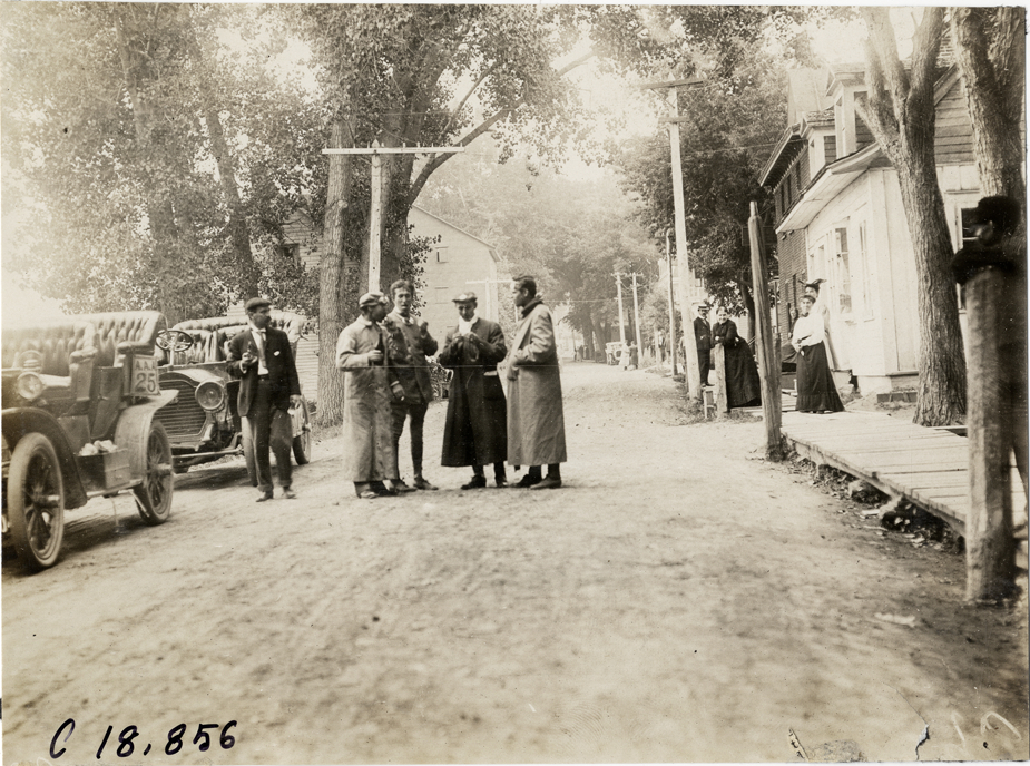 Motorists standing in street, 1906 Glidden Tour