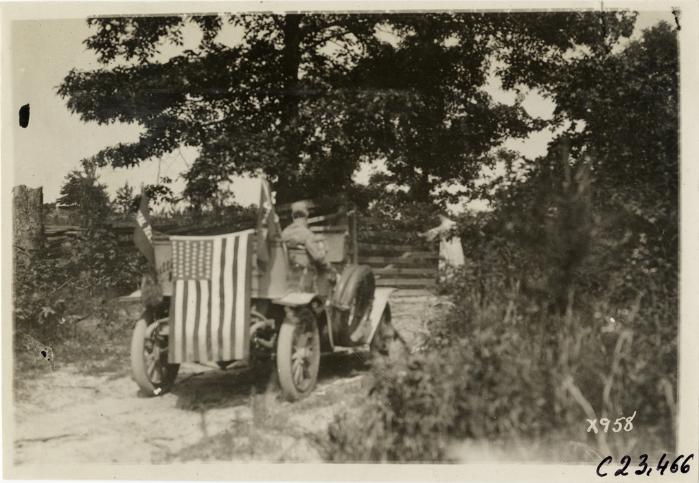 Motorist in Cutting automobile, 1910 Glidden Tour