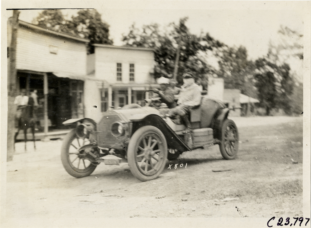 Motorists posing in automobile, 1910 Glidden Tour