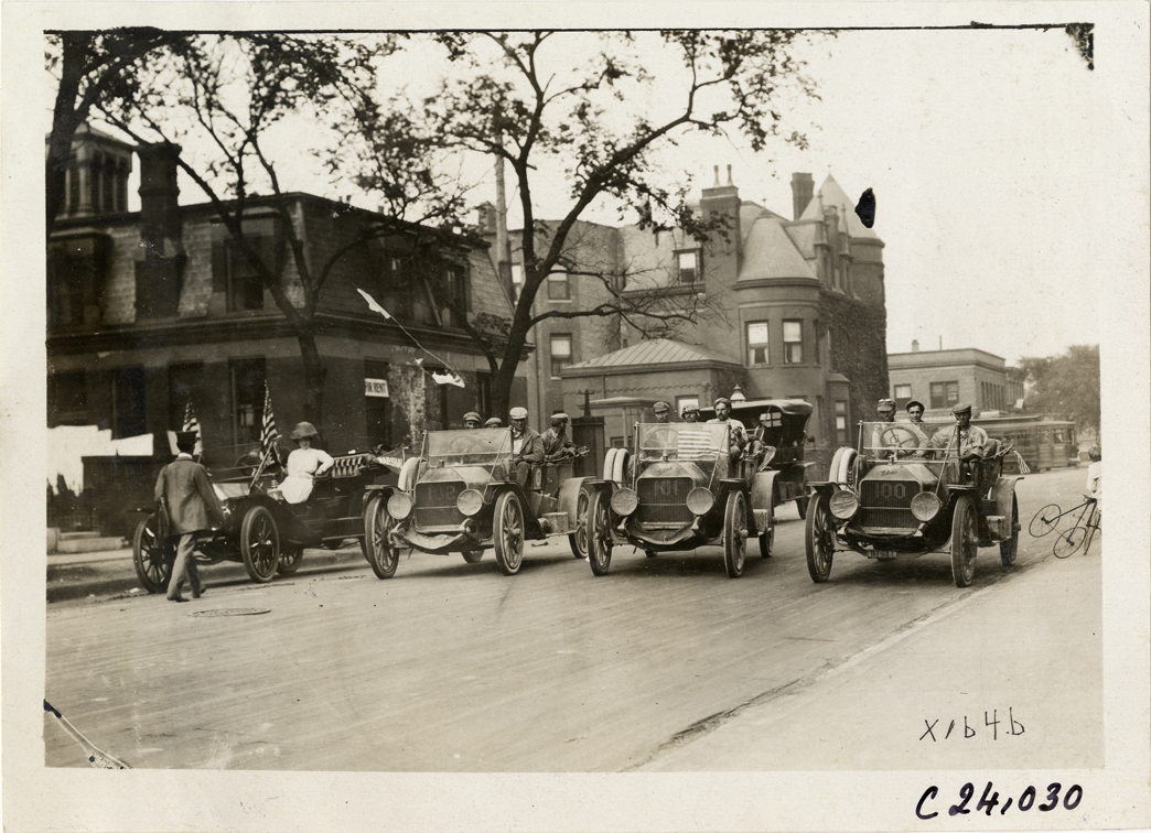 Moline automobiles lined up in street, 1910 Glidden Tour