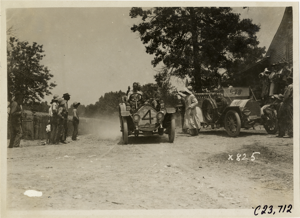 Motorists in Chalmers automobile on rural road, 1910 Glidden Tour