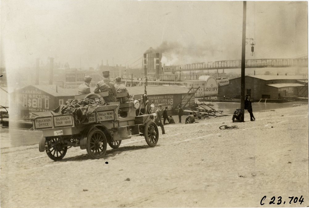 Motorists in Rapid truck traveling along wharf, 1910 Glidden Tour