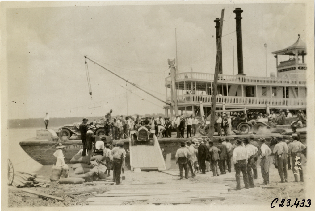 Motorists driving automobiles off barge, 1910 Glidden Tour
