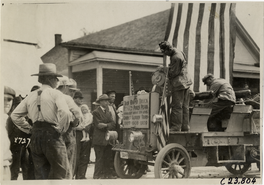 Motorist filling radiator of Rapid truck, 1910 Glidden Tour