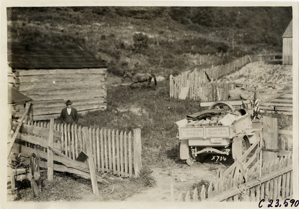 Rapid truck parked in farmyard, 1910 Glidden Tour