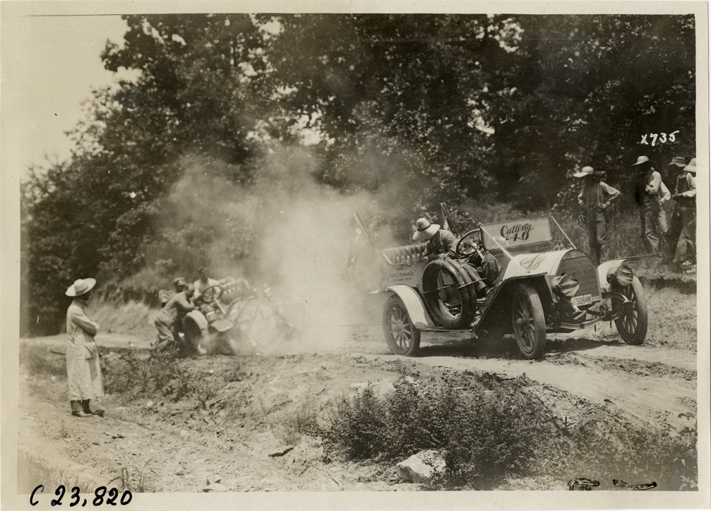 Chalmers automobile stuck on dirt road, 1910 Glidden Tour