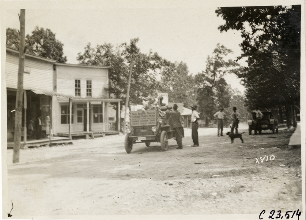 Spectators greeting motorists in Rapid truck, 1910 Glidden Tour