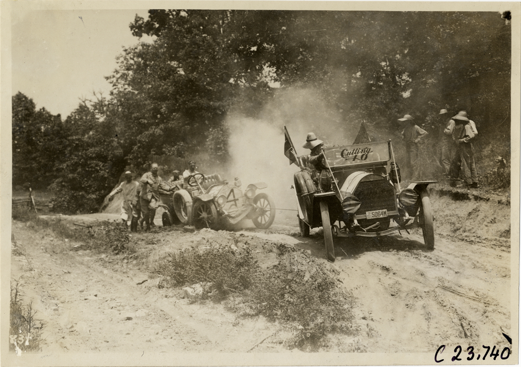 Chalmers automobile stuck on dirt road, 1910 Glidden Tour