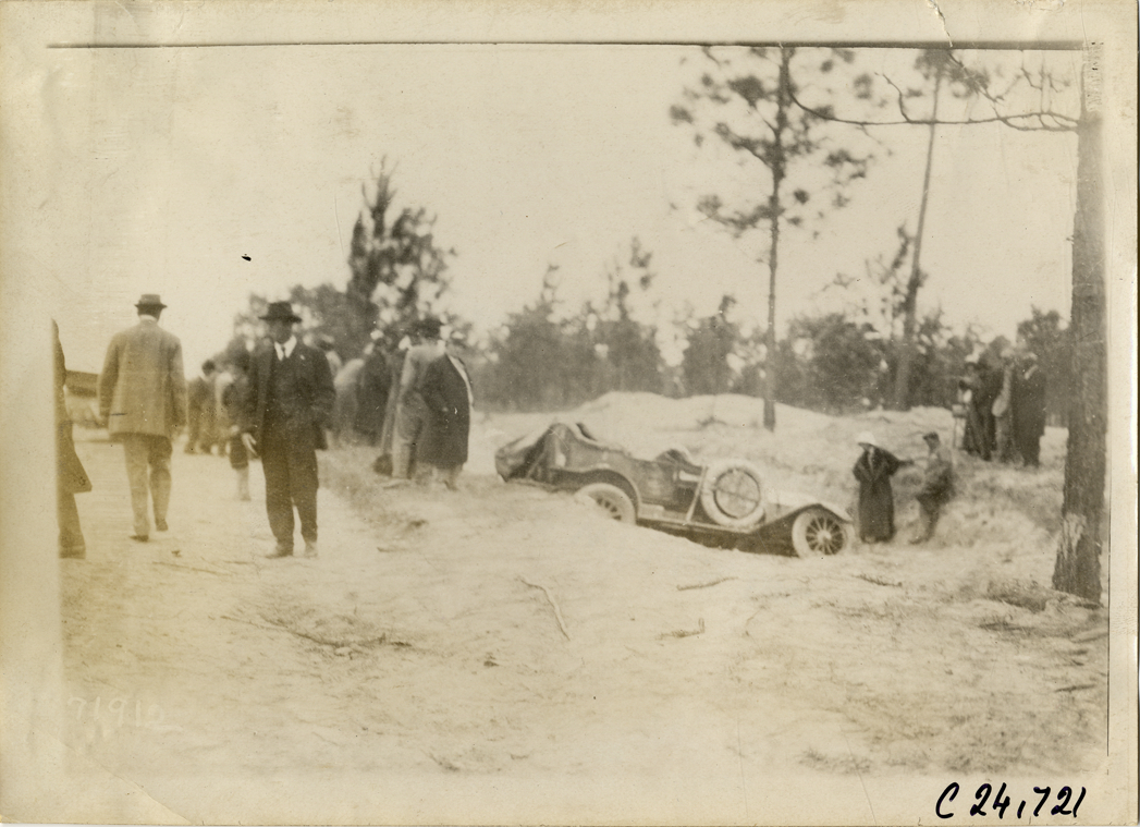 Damaged Cunningham automobile in ditch, 1911 Glidden Tour
