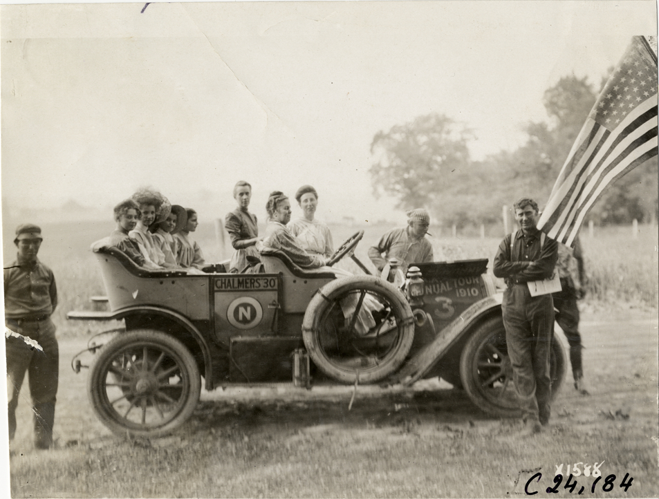 Women posing in Chalmers automobile on roadside, 1910 Glidden Tour
