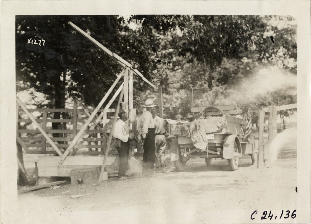 Rapid truck passing through gate, 1910 Glidden Tour