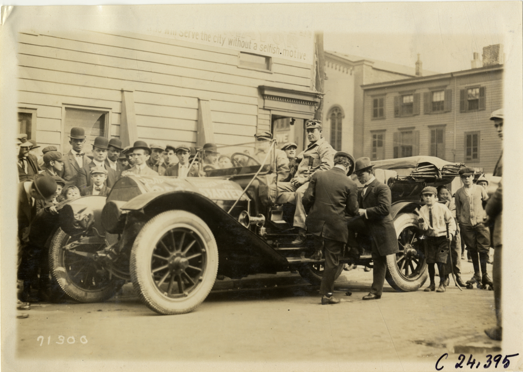 Motorists posing in automobile, 1911 Glidden Tour