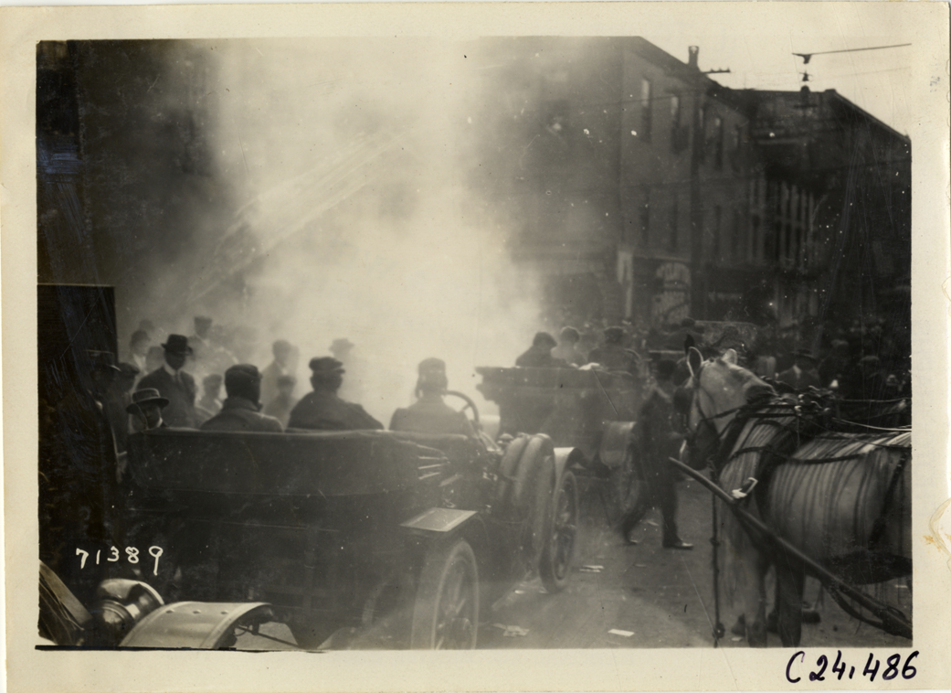 Automobiles lined up in street, 1911 Glidden Tour