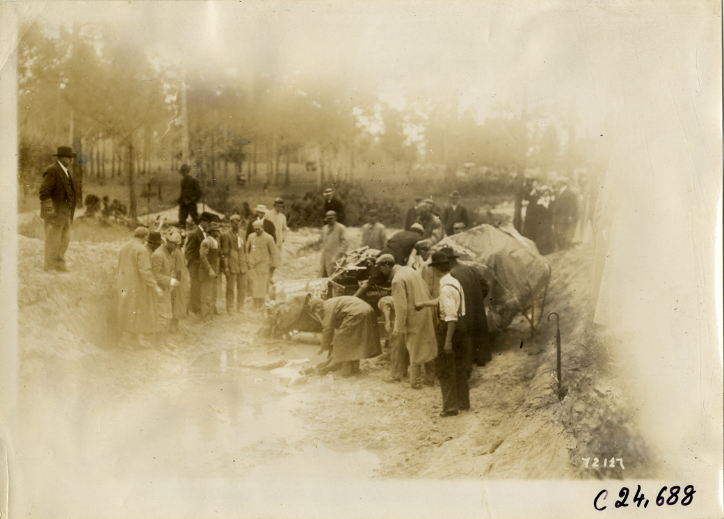 Damaged Cunningham automobile in ditch, 1911 Glidden Tour