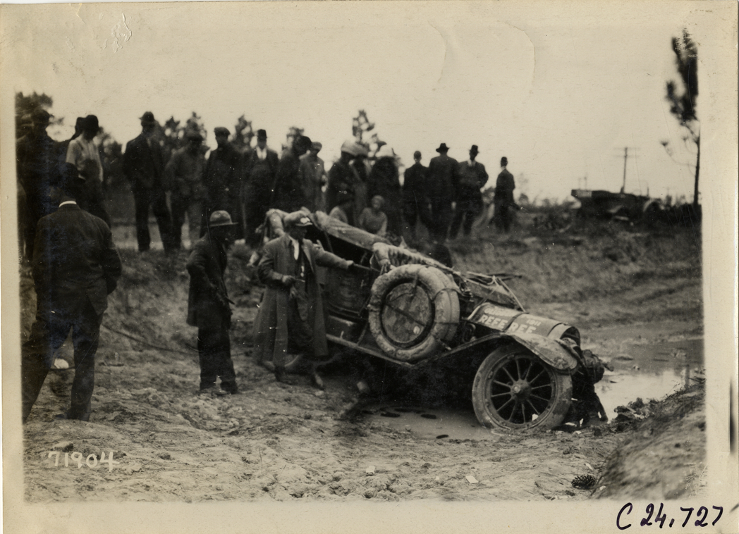 Damaged Cunningham automobile in ditch, 1911 Glidden Tour