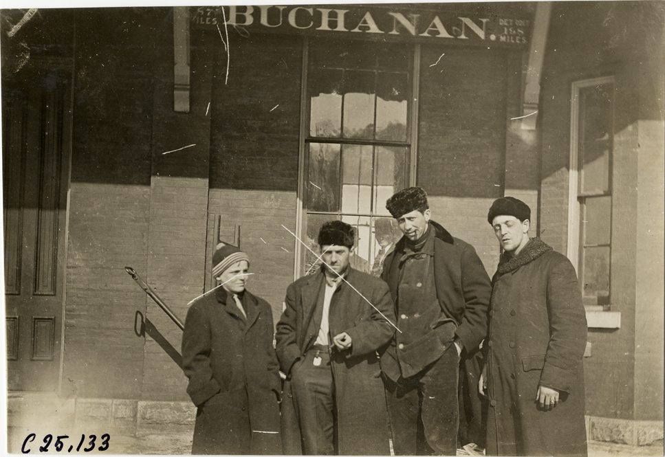 Hupmobile team posing in front of building, 1910 Hupmobile Detroit to New York tour